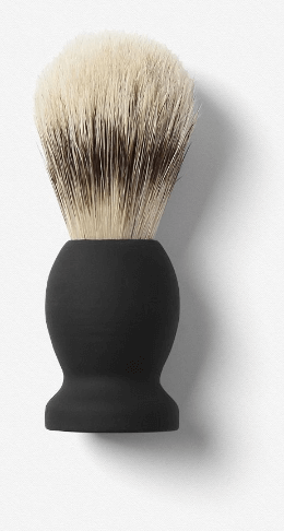 Blaireau de rasage utilisé par un coiffeur barbier
